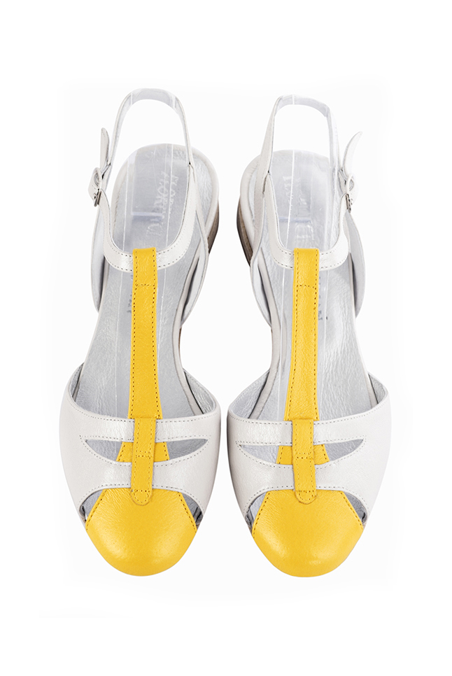 French elegance and refinement for these yellow and pure white dress open back T-strap shoes, 
                available in many subtle leather and colour combinations. This charming flat salomé will nicely replace a more conventional ballerina.
Absolute comfort and singularity for this favorite model !  
                Matching clutches for parties, ceremonies and weddings.   
                You can customize these shoes to perfectly match your tastes or needs, and have a unique model.  
                Choice of leathers, colours, knots and heels. 
                Wide range of materials and shades carefully chosen.  
                Rich collection of flat, low, mid and high heels.  
                Small and large shoe sizes - Florence KOOIJMAN